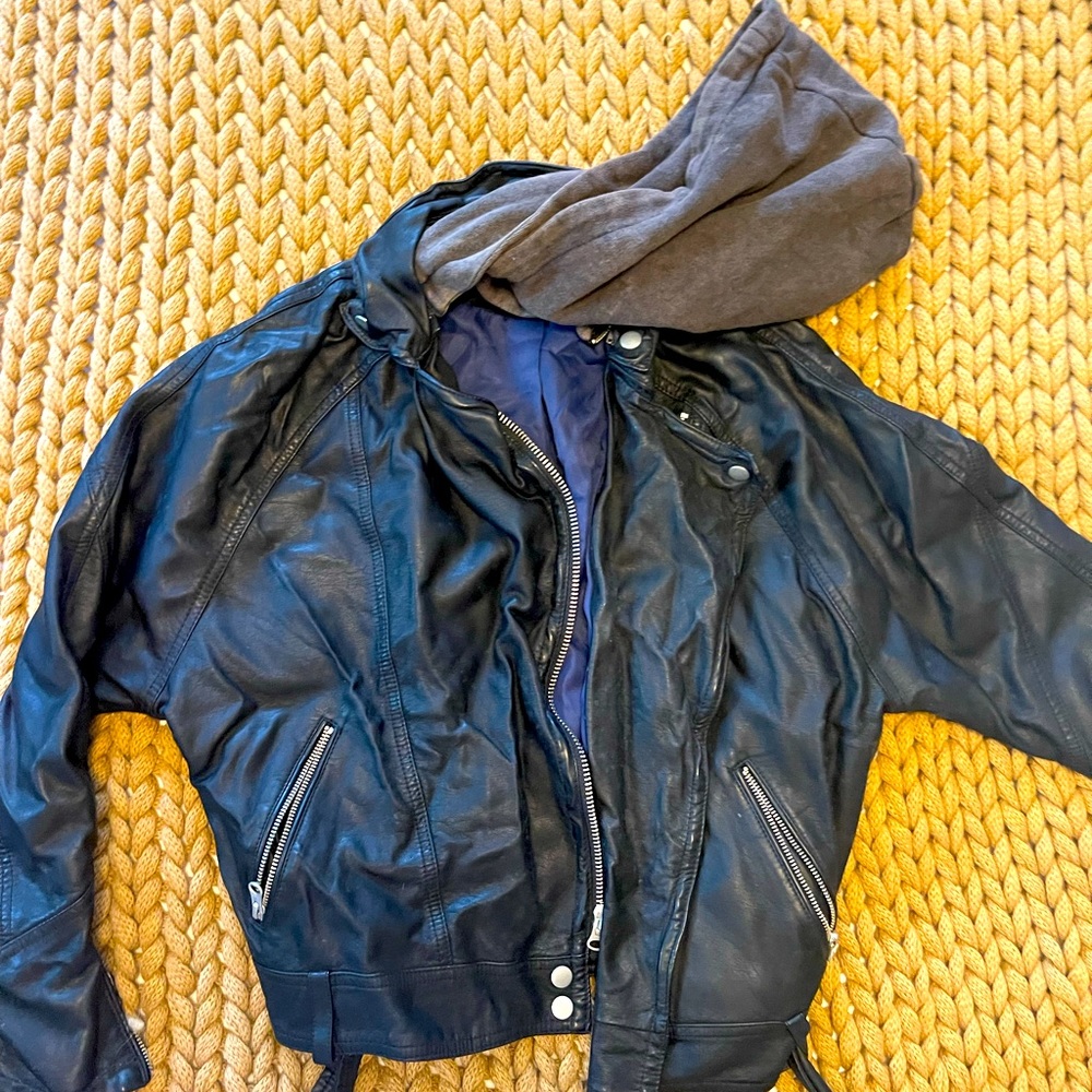 Free People XS black Vegan Leather like new jacket with front buckle.